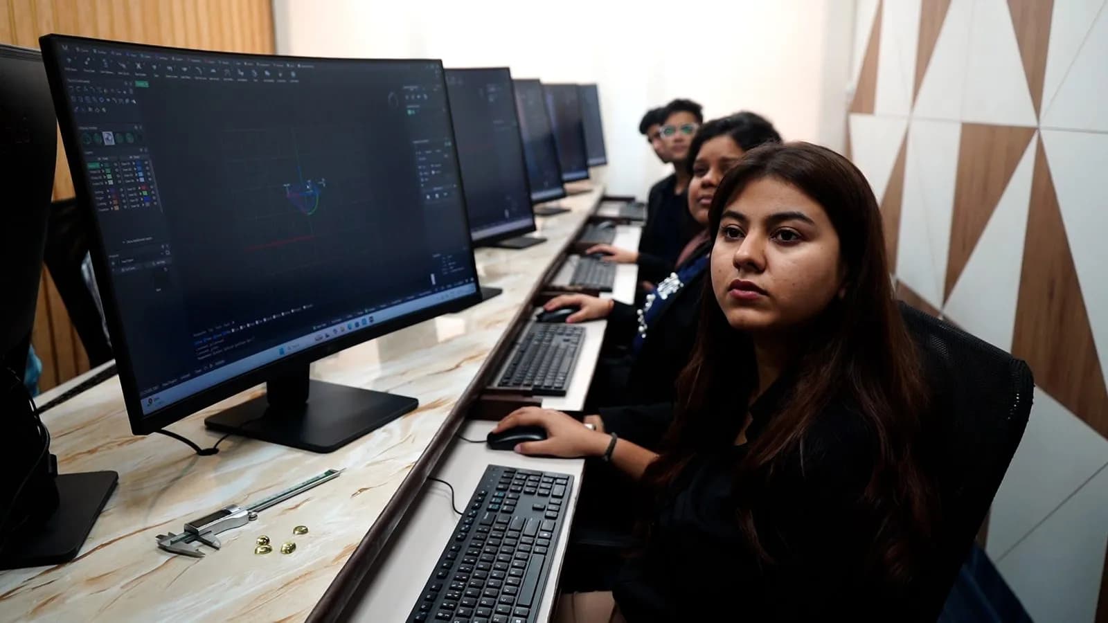 Students modelling jewellery in CAD (Rhino / Matrix) in the digital design lab