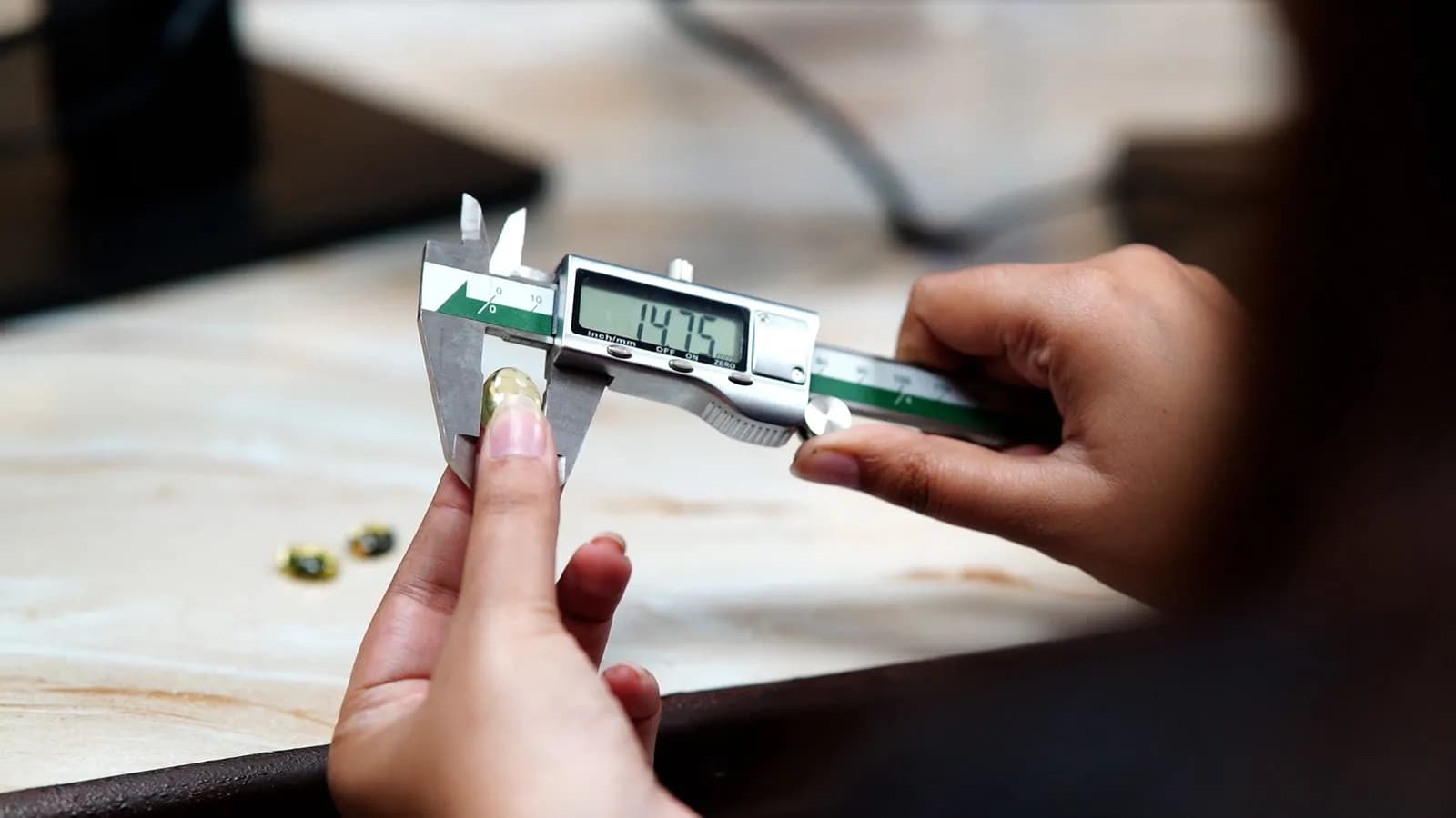 Measuring a gemstone with a digital caliper